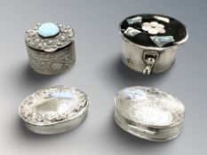 Four silver pill boxes, including one inset mother of pearl, diameter 4 cm.