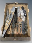 A group of scale model battleships and submarines.