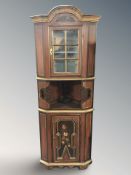 A continental painted and gilt standing corner cabinet, height 196 cm.