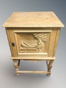 A Danish carved blonde oak single door low cabinet, width 50 cm.