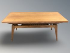 A McIntosh teak pull out extending occasional table,