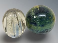 A Mdina / Isle of Wight magnum paperweight and a further clear glass paperweight with bubble