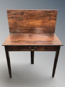 A George III turnover top gate leg tea table fitted a drawer,