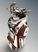 A Wilson golf bag containing assorted irons and drivers including Calloway,