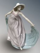 A Lladro figure of a lady in flowing dress No. 5663.