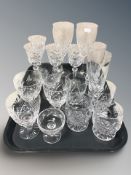 A group of drinking glass including a pair of Waterford crystal wine glasses, height 23 cm.