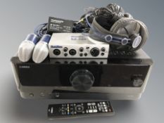 A Yamaha RX-V6A receiver, together with two pairs of sub zero headphones,