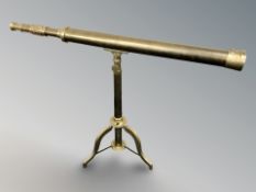 A reproduction brass telescope on stand,