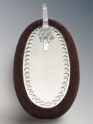 A sorcerer's mirror with glass hook, length 41 cm.