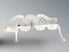 A painted cast metal garden bench, width 134 cm.