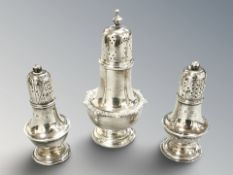 A silver sifter, height 9.5 cm, plus a smaller pair. CONDITION REPORT: 92g gross.