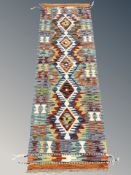 A Chobi Kilim runner, 148 cm x 49 cm.