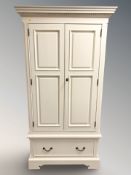 A modern painted double door wardrobe, 103 cm x 61 cm x 196 cm.