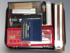 A group of rules, precision drawing set, digital caliper, etc.