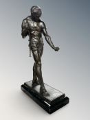 A patinated metal figure of a slave, possibly Spartacus, height 27cm.