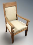 A continental oak open armchair,