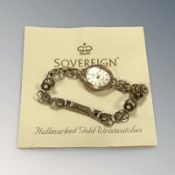 A 9ct yellow gold lady's Sovereign wristwatch with integrated 9ct gold strap CONDITION