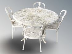 A painted metal circular garden patio table, diameter 130 cm, height 80 cm and four matching chairs.