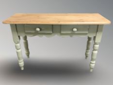A painted pine two drawer side table, 121 cm x 41 cm x 80 cm.