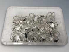 A quantity of new silver plated bangles.