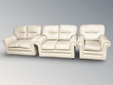 A three piece lounge suite in cream leather CONDITION REPORT: This looks like PU