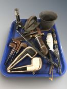 A group of pipes, small microscope, corkscrew, hunting knife, etc.