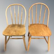 A pair of beech spindleback chairs.