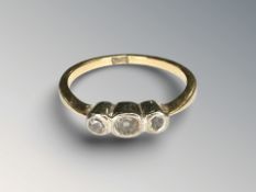 An 18ct yellow gold three stone diamond ring, size L CONDITION REPORT: 2.