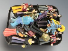 A group of modern plastic The Beatles figurines.