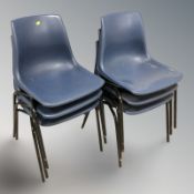 A set of six stacking plastic chairs