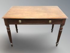 A William IV mahogany writing table fitted a drawer,