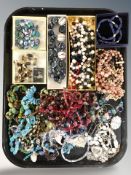 A large quantity of costume bead necklaces, simulated pearls, lapis lazuli necklace, etc.