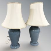A pair of Denby blue glazed pottery table lamps with shades,
