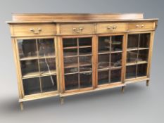 A late Victorian mahogany and satinwood inlaid break-front display cabinet,