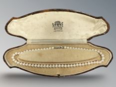 A pearl necklace on 9ct white gold clasp,