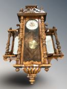 An early 20th century walnut Vienna eight day wall clock, with pendulum and key,
