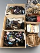 A large quantity of lady's handbags, belts, wicker baskets,