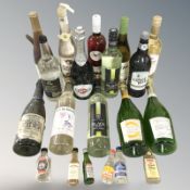 Assorted bottles of alcohol and miniatures including white win, gin, whisky, etc.