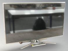 A Samsung 40 inch LCD TV with lead and remote