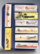 A group of reproduction Dinky die cast scale delivery and haulage wagons, with boxes,