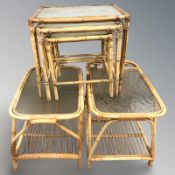 A glass-topped wicker nest of tables and two others similar.