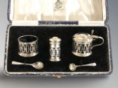 A cased silver cruet set, Reid & Sons, Birmingham marks.