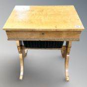A continental satin birch work table,