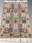 A Ghom rug, of compartmentalised garden design, Central Iran,