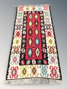 A Caucasian flatweave kilim, 210 cm x 100 cm.