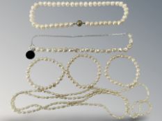 Three pearl necklaces and three pearl bracelets.