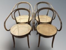 A set of four bentwood and cane armchairs, width 59 cm.