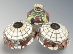 Two Tiffany style stained and leaded glass light shades, diameter 33 cm.