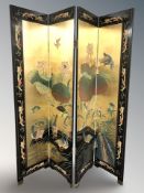 A reproduction oriental fourfold screen depicting birds and other wild fowl,