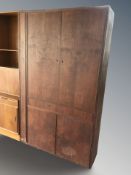 A 20th century Danish teak double door cabinet,